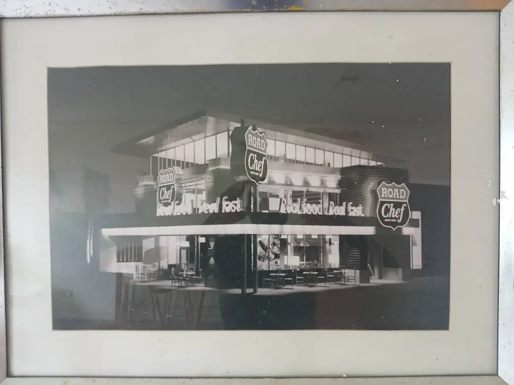 Framed archive photo of the Road Chef drive-through restaurant at night